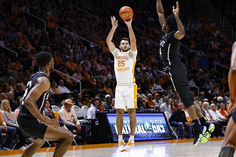 Tennessee guard Santiago Vescovi (25) shoots over Mississippi State guard Cameron Matthews (4) during the first half of an NCAA college basketball game Tuesday, Jan. 3, 2023, in Knoxville, Tenn. (AP Photo/Wade Payne)