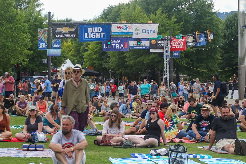 Staff photo by Olivia Ross  / Festival-goers spread out their blankets to watch Kendell Marvel perform on June 3, 2022. The exiting Riverbend Festival weekend kicked off on Friday and continues until Sunday.