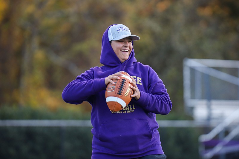 Staff photo by Olivia Ross / Sewanee football assistant coach Shelby Denning helps run the Tigers through drills during an Oct. 19 practice. This past season was Denning's first with the program led by Travis Rundle, who said Denning "killed it in her interview" to coach receivers for the Tigers.