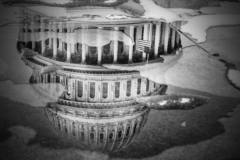 Photo/Mark Peterson/The New York Times / The U.S. Capitol is reflected in a puddle, in Washington, on Jan. 6, 2022. “It had been a century since a speaker wasn’t chosen on the first ballot — and the last time that happened, there was an actual substantive dispute,” writes The New York Times columnist Paul Krugman.