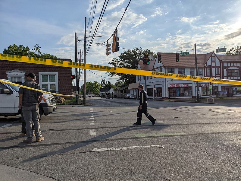 Staff photo by Tierra Hayes / The Chattanooga Police Department investigate near the 2100 block of McCallie Ave. following a shooting on June 5 in downtown Chattanooga.