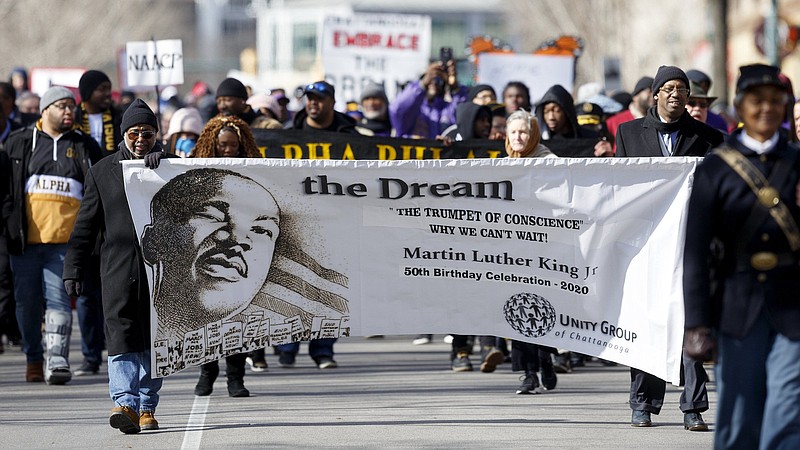 Staff file photo / People take part in a memorial march along M.L. King Boulevard on Jan. 20, 2020, in Chattanooga. The memorial march was part of the Unity Group of Chattanooga's 50th annual Martin Luther King Jr. Week celebration.