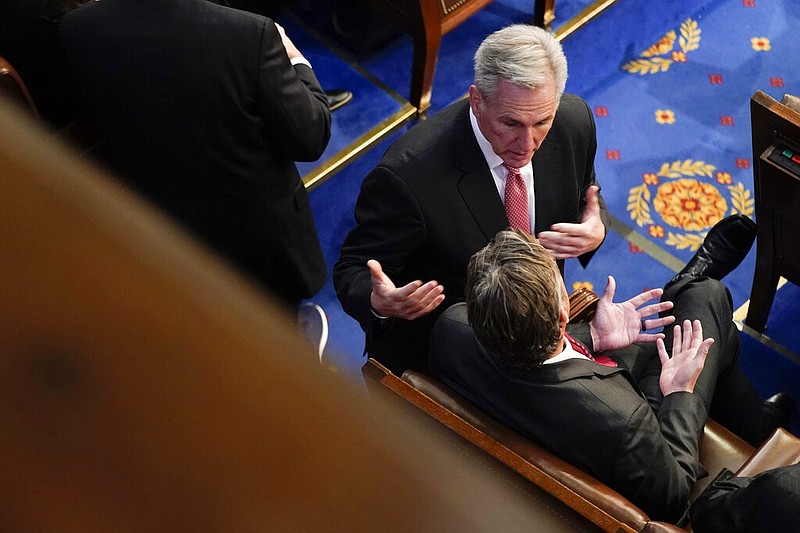 Rep. Kevin McCarthy, R-Calif., talks with Rep. Andy Ogles, R-Tenn. Before the eighth round of voting for speaker as the House meets for the third day to elect a speaker and convene the 118th Congress in Washington, Thursday, Jan. 5, 2023. (AP Photo/Andrew Harnik)