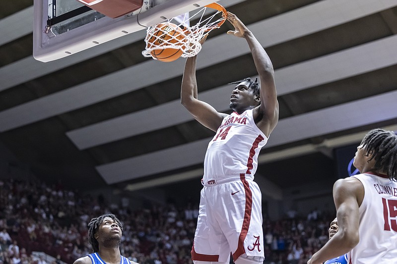 AP photo by Vasha Hunt / Alabama center Charles Bediako dunks during Saturday's lopsided SEC win against visiting Kentucky.