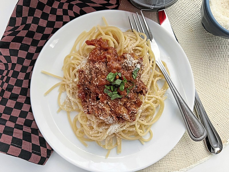 Made with slow-cooked pork shoulder, sausage and meatballs, this rich Sunday sauce can be served on any kind of pasta. / Gretchen McKay/Pittsburgh Post-Gazette/TNS