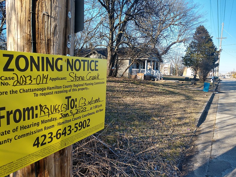 Staff Photo by Mike Pare / A zoning sign sits Monday on Williams Street between West 26th and 27th streets in the South Broad District. A tract is slated to hold new apartments and townhouses near the planned new Chattanooga Lookouts stadium.