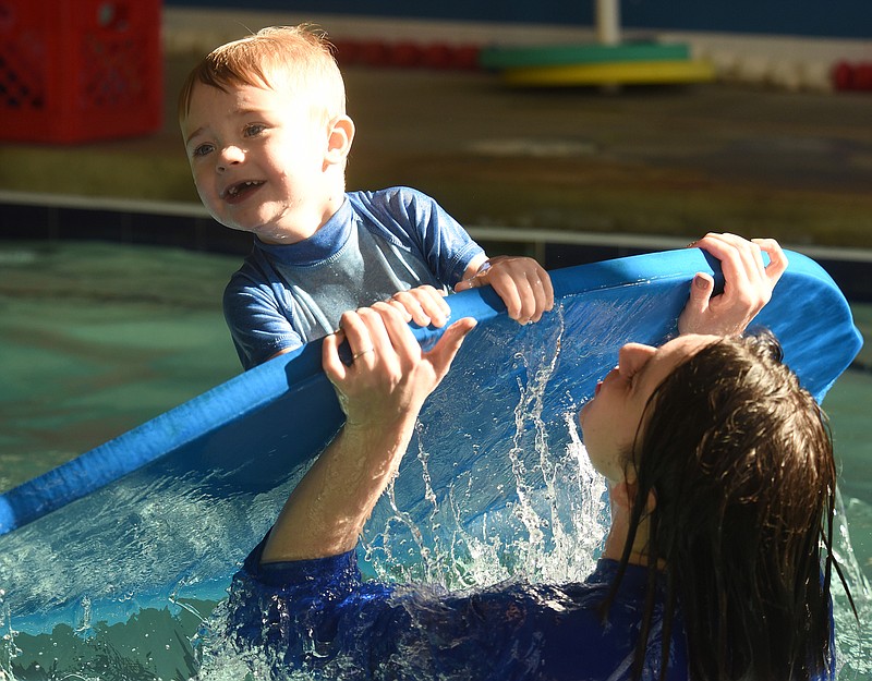 Staff Photo by Matt Hamilton / Instructor Amy Shrader plays with Soddy-Daisy resident Jamison Venezia, 4, at the end of their lesson at Aqua-Tots Swim Schools on  Jan. 5. The business offers classes for children of various skill levels, starting with children 4 months old.