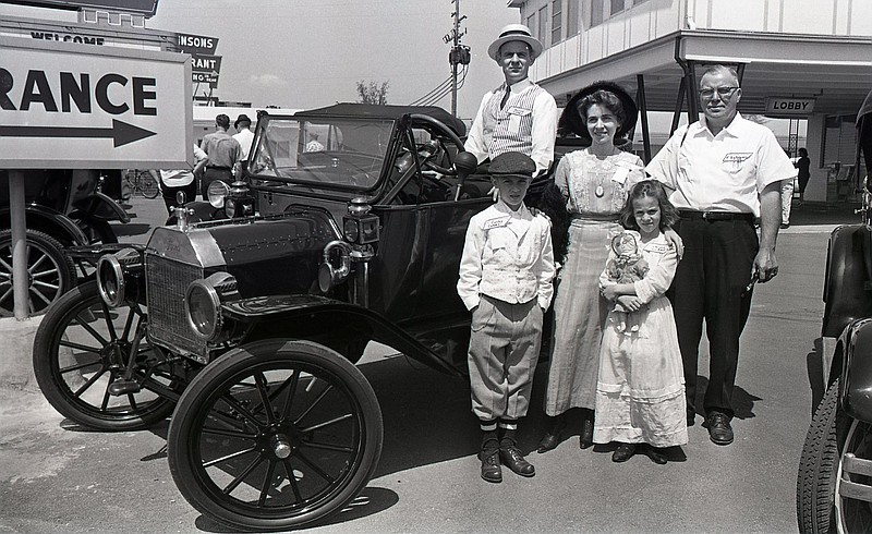 Chattanooga News-Free Press photo via ChattanoogaHistory.com. This 1964 photo, which appeared the the Chattanooga News-Free Press, was taken at a district meeting of the Antique Car Club of America at the Holiday Inn East on Brainerd Road. Pictured, from left, are Corkey Coker (in cap), Harold Coker (seated), Lillian Coker, Christie Coker (with doll) and E.B. Alloway, one of the event directors.