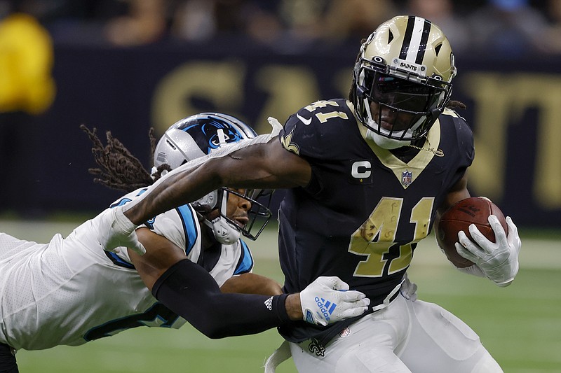 AP photo by Butch Dill / New Orleans Saints running back Alvin Kamara is tackled by Carolina Panthers cornerback Josh Norman on Sunday in New Orleans. The matchup of NFC South teams was a regular-season finale with no playoff implications as both had already been eliminated from contention.