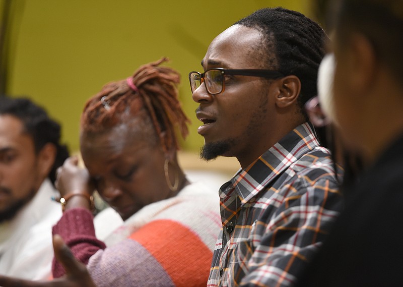 Staff photo by Matt Hamilton / Chrystal Brown wipes away tears as Devonte Brown talks about the death of his brother during a meeting at Eastdale Village Community United Methodist Church on Friday, January 13, 2023.