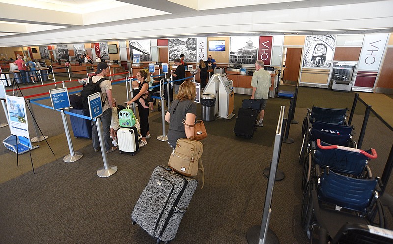 Staff Photo by Matt Hamilton / Passengers line up to check their luggage at Chattanooga Airport on  June 21. Boardings were up nearly 15% in 2022 over 2021 at the airport.