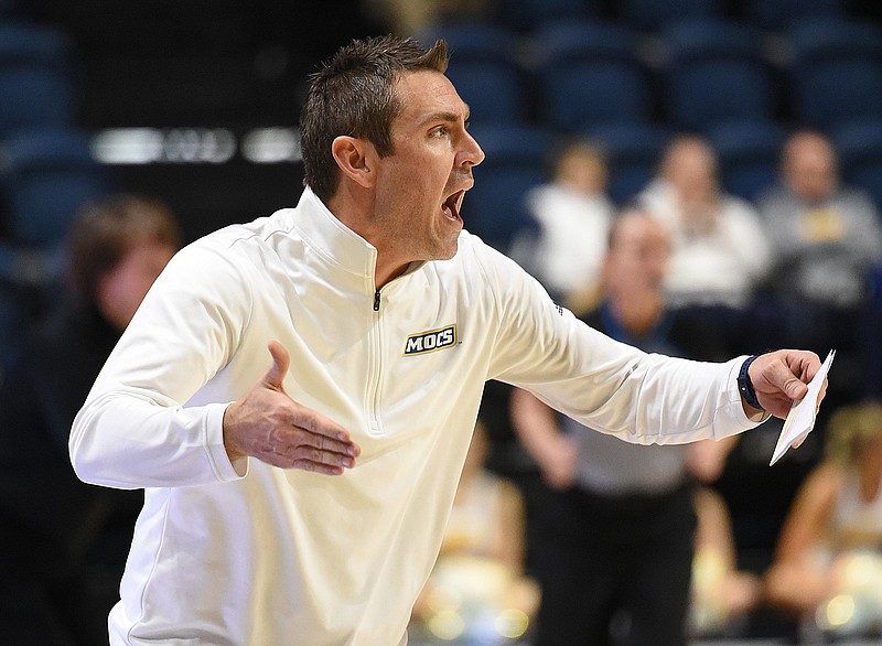 Staff photo by Matt Hamilton / UTC women's basketball coach Shawn Poppie shouts at his team and officials during Saturday's overtime win against visiting Mercer. The Mocs lost Thursday night at Wofford.