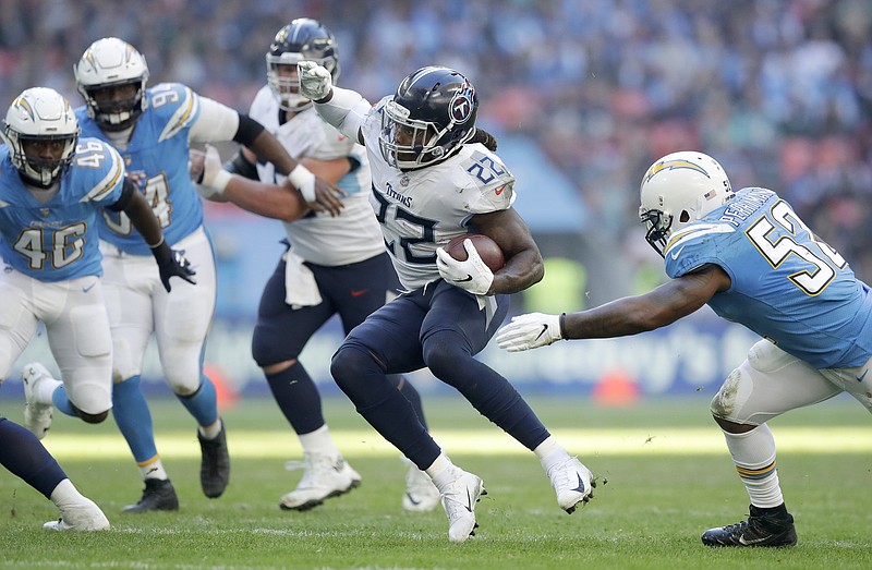 AP photo by Matt Dunham / Tennessee Titans running back Derrick Henry carries the ball during a game against the Los Angeles Chargers in October 2018 at Wembley Stadium. The Titans lost 20-19 that day in their first regular-season game in London, but they'll return to the city this year to play at Tottenham Hotspur Stadium.