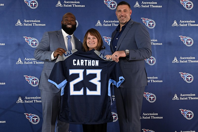 AP photo by Mark Zaleski / From left, Tennessee Titans general manager Ran Carthon, team owner Amy Adams Strunk and head coach Mike Vrabel pose a news conference Friday. Carthon was hired as the team's GM earlier this week and introduced Friday in Nashville.