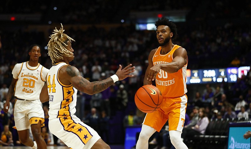 Tennessee Athletics photo / Tennessee senior forward Josiah-Jordan James passes past LSU’s Adam Miller during Saturday afternoon’s 77-56 victory by the No. 9 Volunteers. James scored a season-high 22 points.