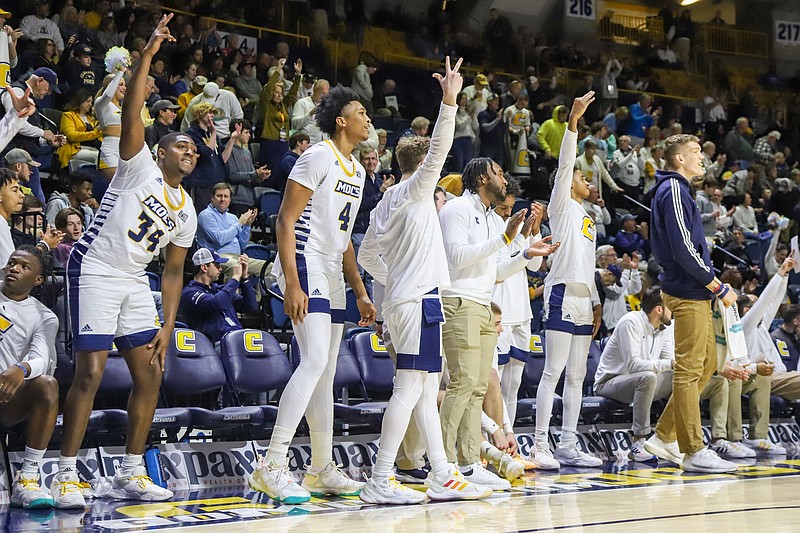 Staff photo by Olivia Ross / UTC basketball standout Jake Stephens, right, did not dress for Saturday's home game against rival East Tennessee State, which beat the Mocs 78-62. Stephens, the SoCon player of the week six times this season, is out indefinitely with a hand injury.