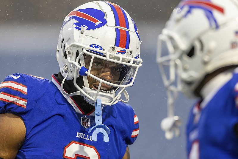 AP photo by Jeff Lewis / Buffalo Bills safety Damar Hamlin, left, warms up before a home game against the New York Jets on Dec. 11 in Orchard Park, N.Y.