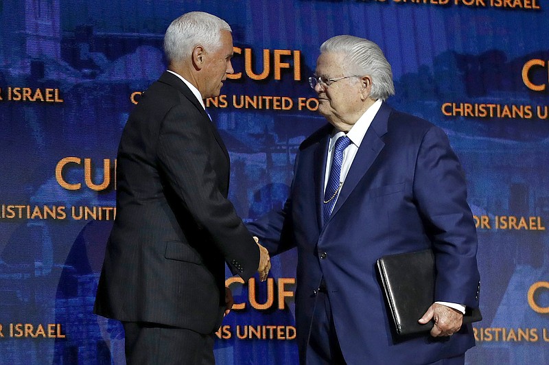 File photo/Patrick Semansky/The Associated Press / In this July 8, 2019, file photo, Vice President Mike Pence, left, greets Pastor John Hagee, a prominent Texas megachurch pastor and conservative activist who founded Cornerstone Church, which his father founded.