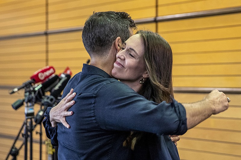 Photo/Mark Mitchell/New Zealand Herald via AP / New Zealand Prime Minister Jacinda Ardern, right, hugs her fiancee Clark Gayford after announcing her resignation at a news conference in Napier, New Zealand, on Thursday, Jan. 19, 2023. Ardern told reporters that Feb. 7 will be her last day in office.