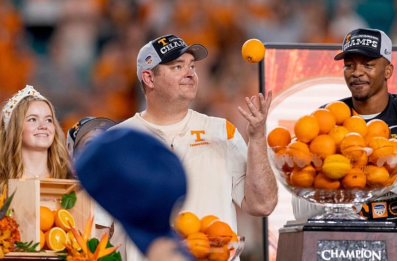 Tennessee Athletics photo / Tennessee football coach Josh Heupel tosses an orange following the 31-14 victory over Clemson in the Orange Bowl on Dec. 30.