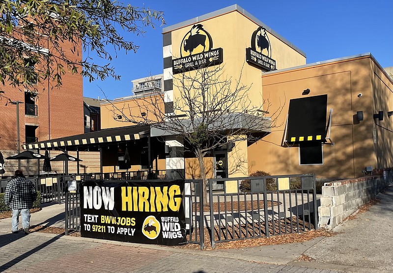 Staff Photo by Dave Flessner / Buffalo Wild Wings in downtown Chattanooga was among many restaurants advertising to fill job openings in November. Chattanooga ended last year with a jobless rate of 2.9%, just a tenth of a percentage point above the all-time low of 2.8%,