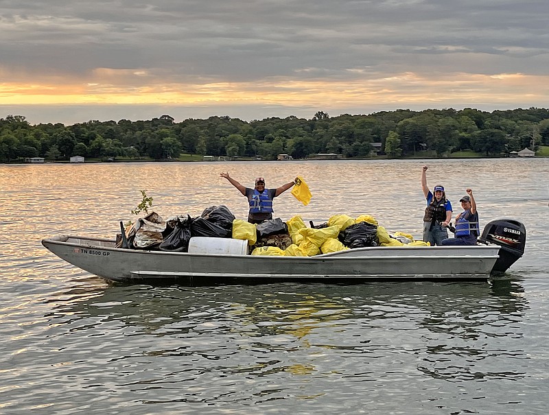 Contributed Photo / Participants in a Tennessee River cleanup have a boatload of trash as they finish their efforts at sunset on June 10, 2022.