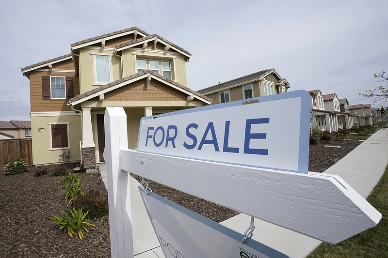 FILE - A "for sale" sign is posted in front of a home in Sacramento, Calif., March 3, 2022. Years of soaring prices turned into big profits for U.S. homeowners who sold their home in 2022, even as the housing market's slump deepened, new data show. (AP Photo/Rich Pedroncelli, File)