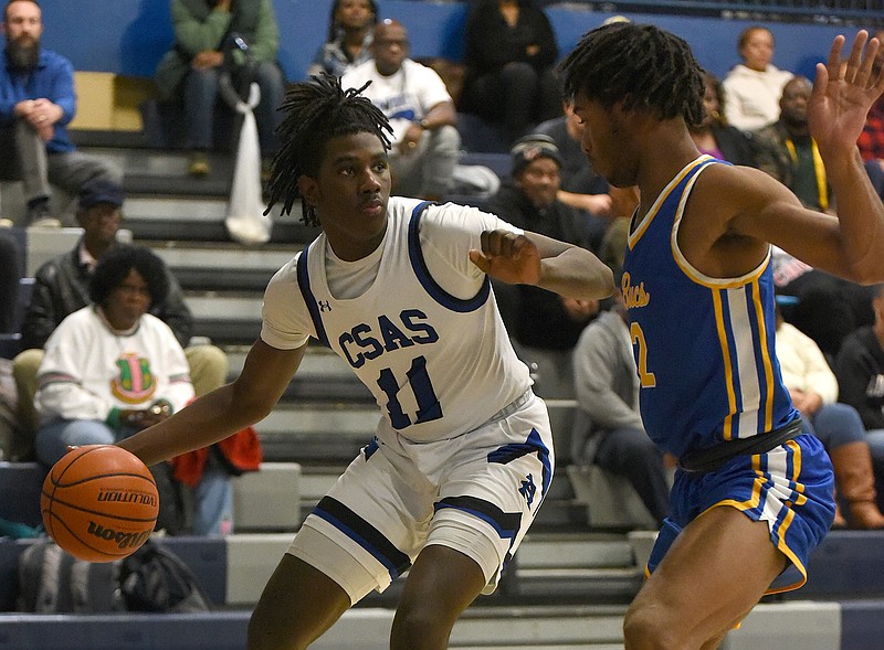 Staff photo by Matt Hamilton / CC Smith controls the ball for Arts & Sciences as Boyd Buchanan's James Nolan defends during Friday night's game.