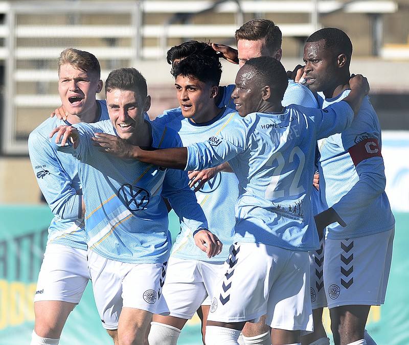 Staff photo by Matt Hamilton / Chattanooga FC players point to Damian Rodriguez after one of his assists during Saturday's 3-3 draw in a preseason match with Atlanta United FC at Finley Stadium.