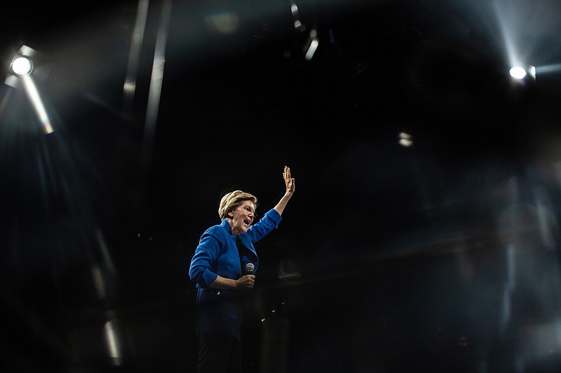 File photo/Jordan Gale/The New York Times / Sen. Elizabeth Warren, D-Mass., waves at an event during her presidential primary run, during which she floated the idea of an “ultra-millionaire tax,” in Des Moines, Iowa, on Nov. 1, 2019.