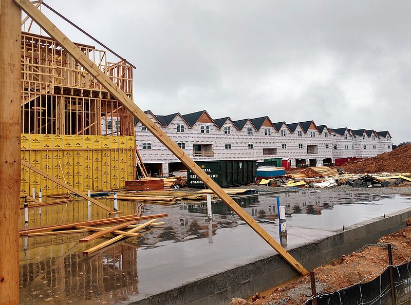 Staff Photo by Mike Pare / A row of townhomes under construction sit Tuesday at Midtown Office Park in Brainerd. The housing, slated to open later this year, is the first in the sprawling office park.