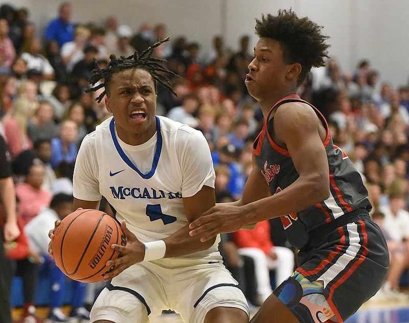 Staff photo by Matt Hamilton / Baylor's Evan Haynie, right, guards McCallie's Kollin Claridy during the Best of Preps title game on Dec. 30 at Chattanooga State. Claridy and Haynie, both seniors, have been best friends since they were toddlers despite being on opposing basketball teams for much of that time. Their schools will meet again Friday night in a Division II-AA East Region game at McCallie.