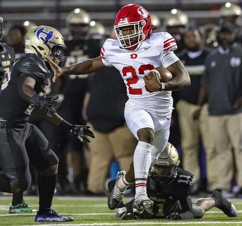 Phelan Photography photo / Dalton running back Tyson Greenwade shakes a defender during the team's win at Hiram in September. The senior, who rushed for 375 yards that night, signed with Charleston Southern University on Wednesday.