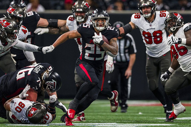 Atlanta Falcons running back Tyler Allgeier runs the ball during the second half of game against the Tampa Bay Buccaneers on Jan. 8 in Atlanta. The Falcons won 30-17. 
Georgia sports fans could put money down on the Falcons and other professional sports teams if the legislature passes a bill to legalize online sports betting in the state. (AP Photo/Danny Karnik)