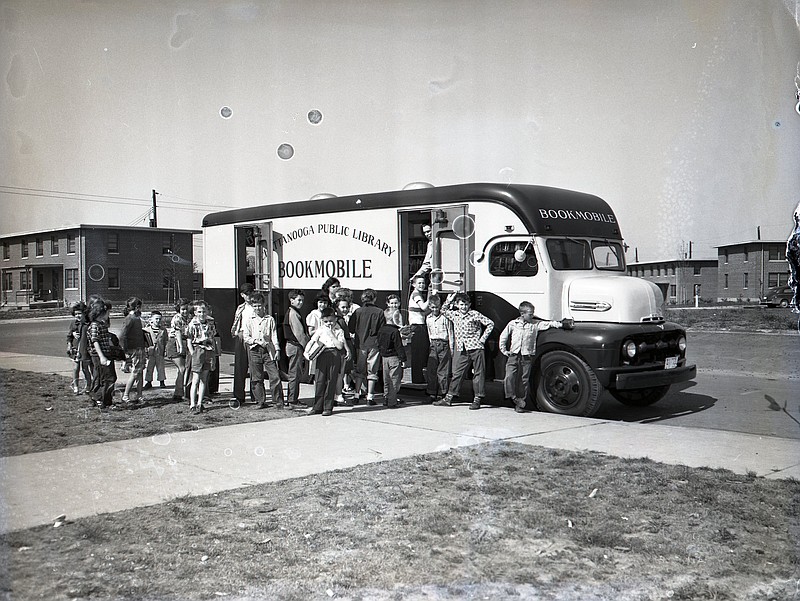 Chattanooga News-Free Press photo via ChattanoogaHistory.com. Children lined up in 1953 to check out books from a bookmobile in East Chattanooga.