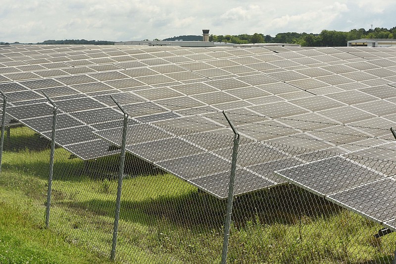 Staff Photo / Lovell Field's Federal Aviation Administration control tower is seen, top center, in 2019 over dozens of panels on the Solar Farm at the Chattanooga Metropolitan Airport.