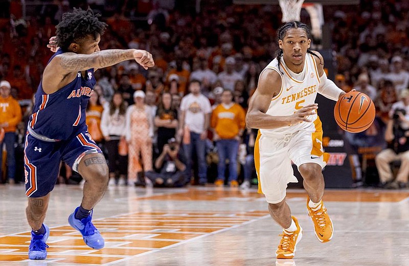 Tennessee Athletics photo by Andrew Ferguson / Tennessee guard Zakai Zeigler drives past Auburn's Wendell Green during last season's 67-62 win by the Volunteers in Knoxville.