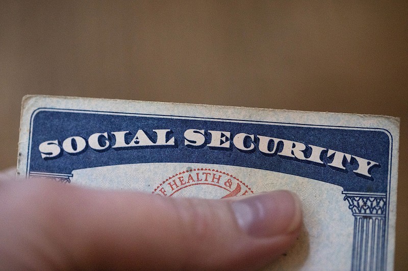 File photo/Jenny Kane/The Associated Press / A Social Security card is displayed on Oct. 12, 2021, in Tigard, Ore. The annual Social Security and Medicare trustees report released Thursday, June 2, 2022, says Social Security’s trust fund will be unable to pay full benefits in 2035.