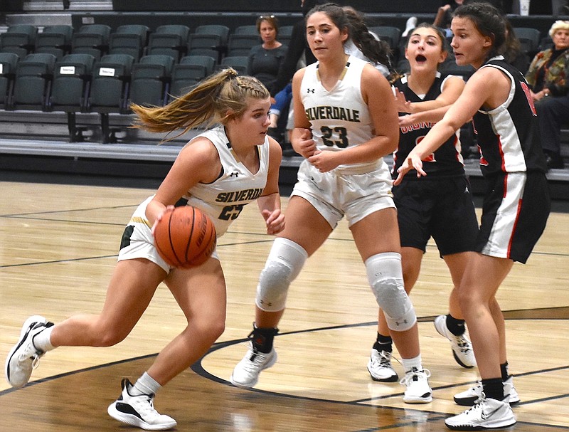 Staff file photo by Patrick MacCoon / Silverdale Baptist junior guard Kelsie Johnson, with ball, helped the Lady Seahawks capture a share of the regular-season district title with a 10-point home win over Boyd Buchanan on Friday night.