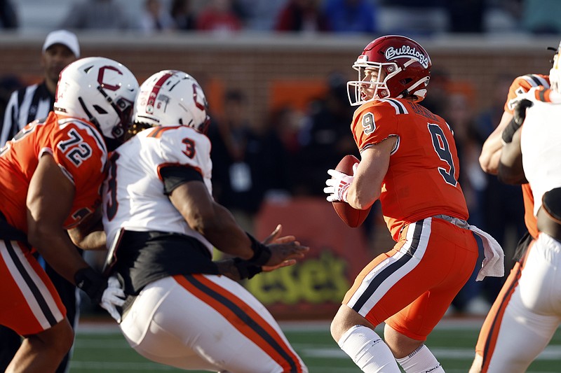 AP photo by Butch Dill / Former Fresno State quarterback Jake Haener looks for a receiver while playing for the National team during the Senior Bowl on Saturday in Mobile, Ala.