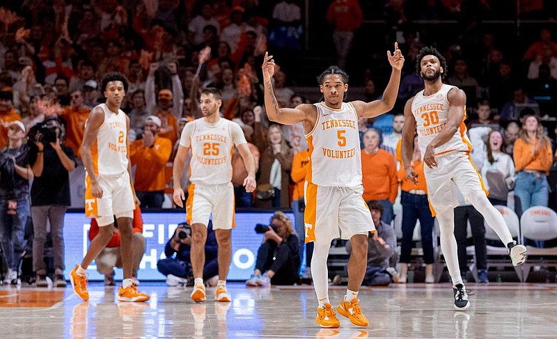 Tennessee Athletics photo / Tennessee basketball players Julian Phillips (2), Santiago Vescovi (25), Zakai Zeigler (5) and Josiah-Jordan James (30) celebrate Saturday afternoon's 46-43 win over Auburn.