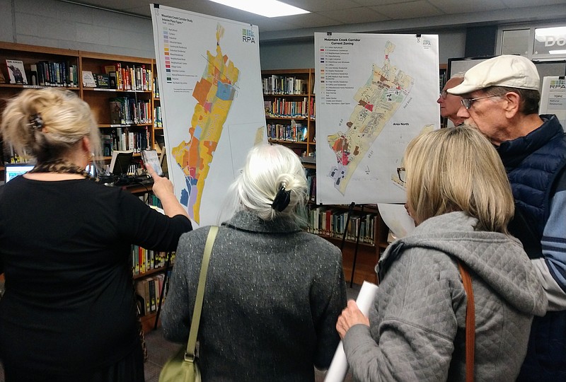 Staff Photo by Mike Pare / People surround maps of the Mountain Creek Road corridor at a meeting Monday at Red Bank High School. Chattanooga planners revealed details of a new land-use study.