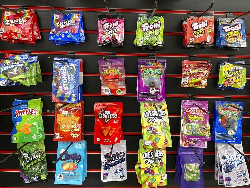 An array of products advertised as containing synthetically derived delta-8 THC is offered for sale at a smoke shop in Seattle on Feb. 25, 2022. Many THC products are packaged to look similar to popular snacks. (AP Photo/Gene Johnson)