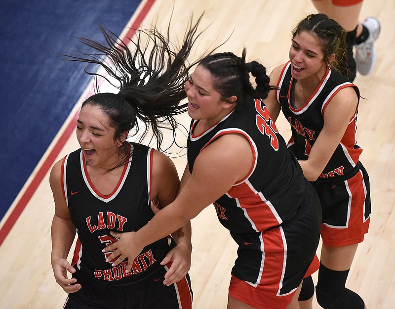 Staff photo by Matt Hamilton / Sonoraville (30) Diana Smith, (35) Taylor West and (4) Jovanna Sicairros celebrate their win after their game at Heritage High School on Tuesday, February 7, 2023. Sonoraville won the game, 47-38.