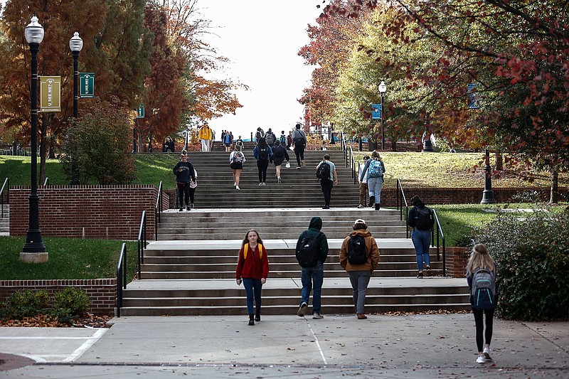 Staff photo by Troy Stolt / Students walk through campus at UTC between classes on Nov. 17, 2021.