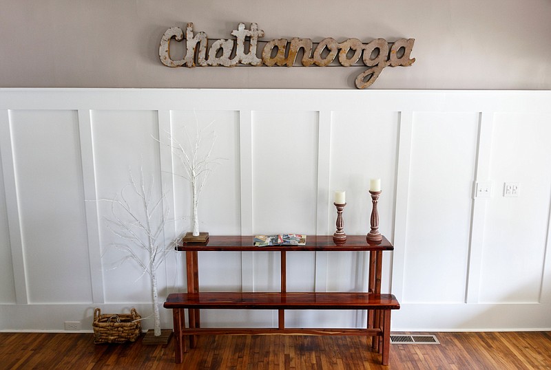 Staff photo / A Chattanooga sign hangs in a home managed by short-term rental management company Chattanooga Vacation Rentals on July 9, 2019.