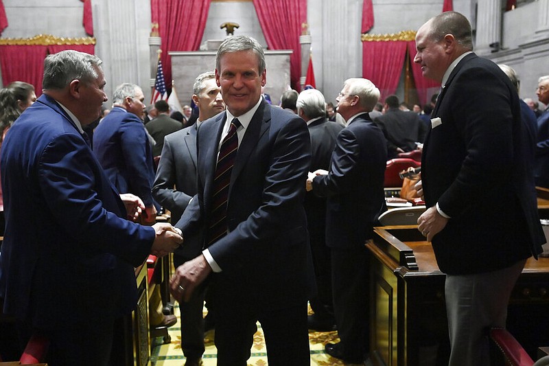 Tennessee Gov. Bill Lee greets legislators as he leaves the House Chamber after giving his his State of the State Address on Monday in Nashville. (AP Photo/Mark Zaleski)