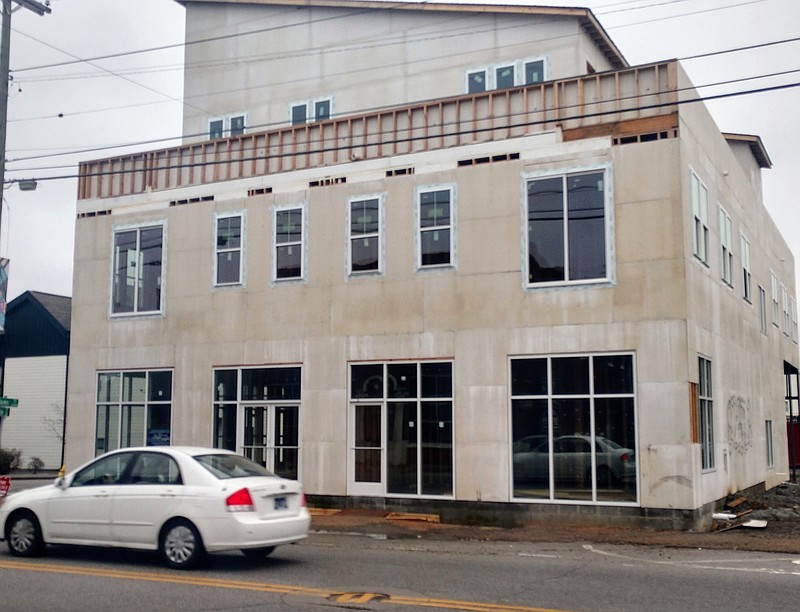 Staff Photo by Mike Pare / Construction of apartments or condominiums is underway in a new building on Main Street in downtown Chattanooga's Southside. The work at Main and Adams streets is shown Wednesday.