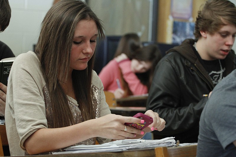 Staff File Photo / A Soddy-Daisy High School student uses an application on her iPhone to conjugate verbs during a Spanish class.