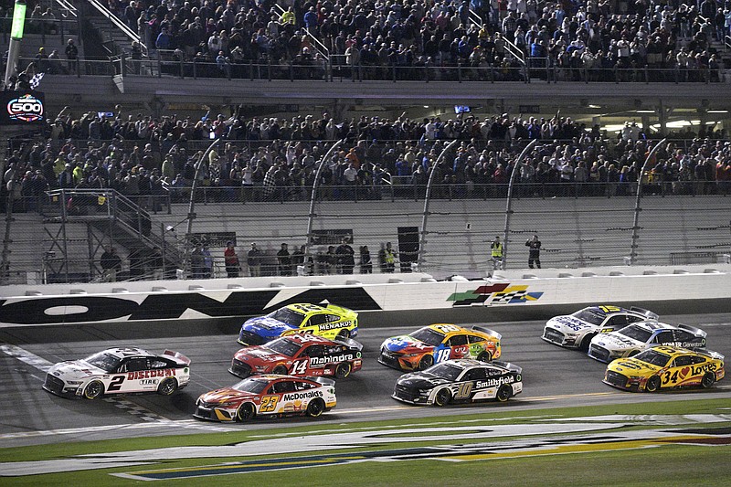 FILE - Austin Cindric (2) takes the checkered flag in front of Bubba Wallace (23) to win the NASCAR Daytona 500 auto race at Daytona International Speedway, Sunday, Feb. 20, 2022, in Daytona Beach, Fla. As Kevin Harvick prepares to depart, the stage is open to be seized by Noah Gragson, watermelon farmer Ross Chastain and Daniel Suarez, the only Mexican-born winner in NASCAR history. There’s also Cindric, a Team Penske fixture who won last year’s Daytona 500 as a rookie on Roger Penske’s 85th birthday, or Bubba Wallace, the only Black driver competing at NASCAR’s top level. (AP Photo/Phelan M. Ebenhack, File)